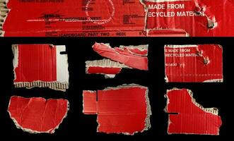 Set of ripped red cardboard pieces isolated on black background photo