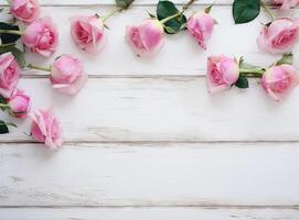 round frame wreath pattern with roses, pink flower buds, branches and leaves isolated on white background. flat lay, top view created with technology. photo