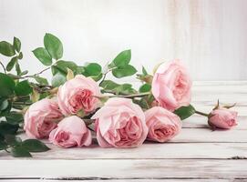 round frame wreath pattern with roses, pink flower buds, branches and leaves isolated on white background. flat lay, top view created with technology. photo