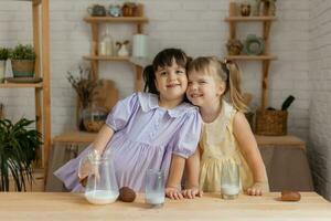 little happy girls fool around in the spring and cook in the kitchen photo