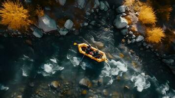 Aerial top view Extreme sport kayak sails mountain river with sun light. Rafting, whitewater kayaking. photo