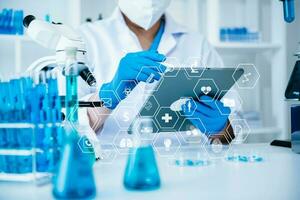 Dctor work on digital tablet healthcare doctor technology tablet using computer  in laboratory study with vr icon photo