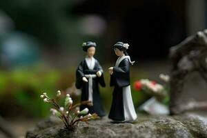 Miniature Japanese vintage wedding, natural diorama. Japanese wife in traditional outfits. Concept of classical romance, love and relationships created with Generative AI Technology photo