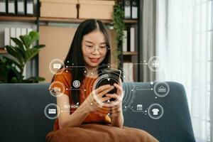 Woman Hand using tablet ,laptop, and holding mobile phone with credit card online banking payment communication network, internet application virtual icon photo