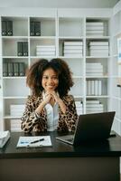 Business woman using tablet and laptop for doing math finance on an office desk, tax, report, accounting, statistics, and analytical research concept in office photo