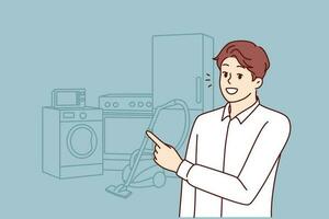 Man appliances salesman points finger at washing machine and vacuum cleaner with refrigerator. Smiling guy in shirt offers to visit home appliances store to create comfort in house vector