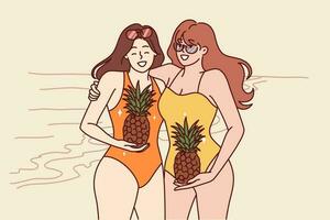 Two women in swimsuits stand on beach with pineapples in hands and smile inviting visit tropical island. Young happy girls in swimsuits spend holidays on sunny beach near sea or ocean vector