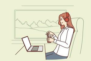 Woman train passenger uses laptop working on trip and drinks coffee sitting near large window in train carriage. Successful girl traveler in headphones sits in train watching movies vector