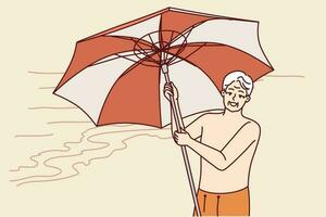 mayor hombre soportes en playa y sostiene paraguas a proteger desde Dom durante viaje a tropical complejo. pensionista es contento acerca de Jubilación y viajes alrededor del Sur islas broncearse en mar playa vector