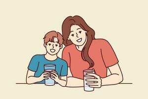 Happy mom and son drink water from transparent glasses and smile enjoying clean refreshing beverage. Positive family with water look at camera together and smile urging to drink more liquid vector