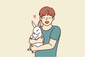 Boy with little rabbit laugh hugging beloved pet for concept of love for domestic animals. Happy child with white eared rabbit for advertising pet store with goods for pets and their owners vector