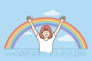 Happy girl rejoices at rainbow appeared in blue sky after rain, and runs across field with tall grass. Child teenager with smile raises hands enjoying spring weather and beautiful rainbow. vector