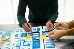 Creative digital development agency. UX graphic designer planning application process development prototype wireframe for web smart phone. photo