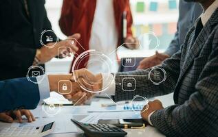 Co working team meeting concept,business with smart phone and laptop and digital tablet computer in office with virtual interface icons photo