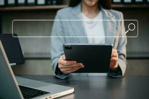 Searching Browsing Internet Data Information Networking Concept with blank search bar. woman working with mobile phone and laptop computer photo