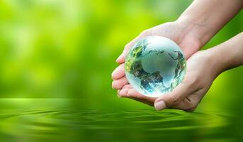 Concept Save the world save environment The world is in the grass of the green bokeh background photo