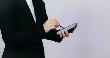 Businessman using digital smart phone with modern mobile phone. New technologies for success workflow concept. photo