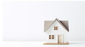 miniature house on white background with copy space. saving money and property investment concept. photo