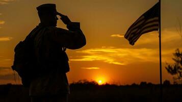 A soldier saluting the flag, the sun setting in the background photo