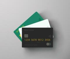 three credit cards lying on grey background vector