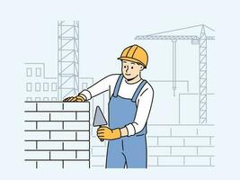 Positive male worker in uniform and helmet building house with bricks. Smiling man engineer busy laying blocks at construction site. Vector illustration.