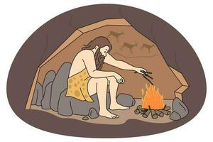 Caveman making fire in cave vector