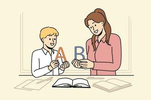 Back to school concept with boy learning alphabet along with elementary school teacher standing near table with books. Woman teaches child read or spell correctly, wanting give son quality education vector