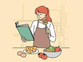 mujer con libro de cocina es en pie en cocina falto a cocinar delicioso cena y vegetales y queso con huevos. niña cocinar en delantal usos libro de cocina mientras preparando ensalada o aperitivos vector