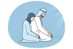 Muslim man and woman praying vector