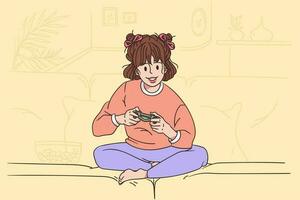 Children playing video games concept. Small smiling girl cartoon character sitting on sofa and playing video game with remote controller alone feeling playful vector illustration