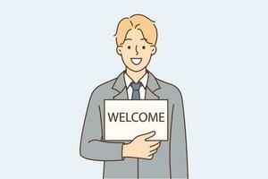 Man in business suit with inscription welcome on piece of paper invites to join team of company or corporation. Guy manager with smile looks at screen calling to get business education vector