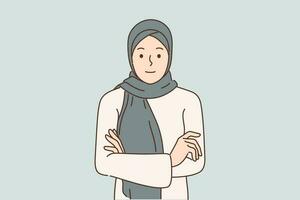 árabe mujer en hijab soportes con brazos cruzado y mira a pantalla para concepto musulmán estilo en ropa y diversidad en moda. hermosa niña en hijab cubierta pelo a cumplir con étnico tradiciones vector