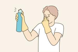 Dissatisfied man with aromatic spray to remove unpleasant odors covers nose with hand while spraying freshener. Householder guy uses air freshener to mask smell in unventilated room vector