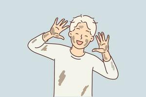 Cheerful dirty boy of pre-adolescent age laughs and shows palms and face stained with clay from puddle. Happy childhood for little blond boy in dirty clothes enjoying knowledge of world vector