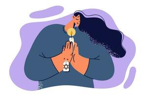 Praying jewish woman holds candle and amulet with star of david, performing religious ritual to appeal to god. Jewish girl praying with palms clasped in front of chest and eyes closed vector