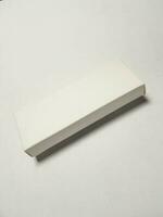 Isolated white photo of a rectangular white packaging box. It is suitable for mock up your packaging products.