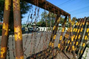 Wonosobo, Indonesia - April 5, 2023 - Barbed wire on roadside. Equipment for police to handle demonstrations and protest. photo