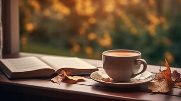 Autumn scene An open book on a table, Good morning in the background, photo