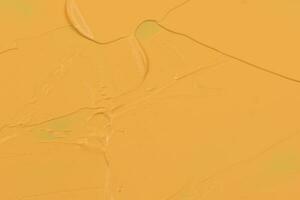 Abstract yellow acrylic paint texture background photo