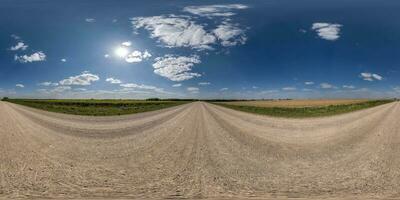 360 hdri panorama on gravel road with clouds on blue sky in equirectangular spherical  seamless projection, use as sky replacement in drone panoramas, game development as sky dome or VR content photo