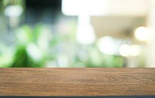 Wood Table Top in Blur Background room interior with empty copy space. photo