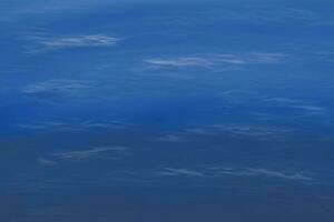 Blue color background in hand drawn ocean water.  Blue abstract Water wave background. photo