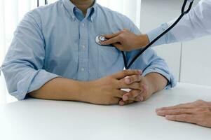 Doctor check body by stethoscope. photo