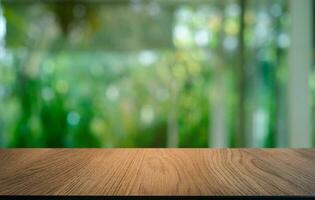 Empty dark wooden table in front of abstract blurred bokeh background of restaurant . can be used for display or montage your products.Mock up for space. photo