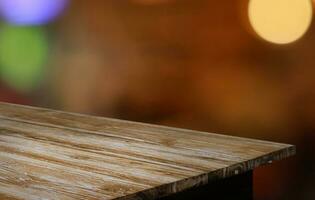 Empty wooden table in front of abstract blurred background of coffee shop . can be used for display or montage your products.Mock up for display of product photo