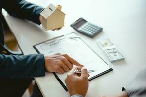 Business people signing contract making a deal with real estate agent Concept for consultant and home insurance concept. photo