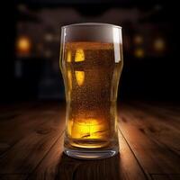 Glass of beer on a wooden table with bokeh background photo