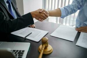 Lawyer Legal counsel Businessman shaking hands successful making a deal. mans handshake. Business partnership meeting concept. photo