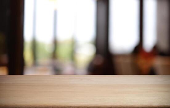 Empty wooden table in front of abstract blurred background of coffee shop . can be used for display or montage your products.Mock up for display of product photo