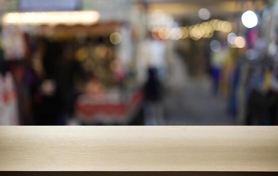 Empty wooden table in front of abstract blurred background of coffee shop . can be used for display or montage your products.Mock up for display of product photo